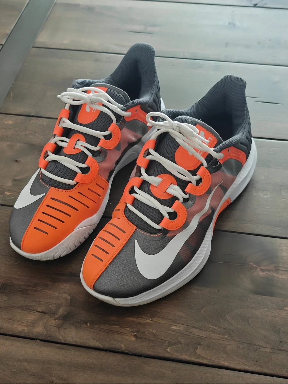 Nike Gray and Orange Athletic Sneakers with White Swoosh